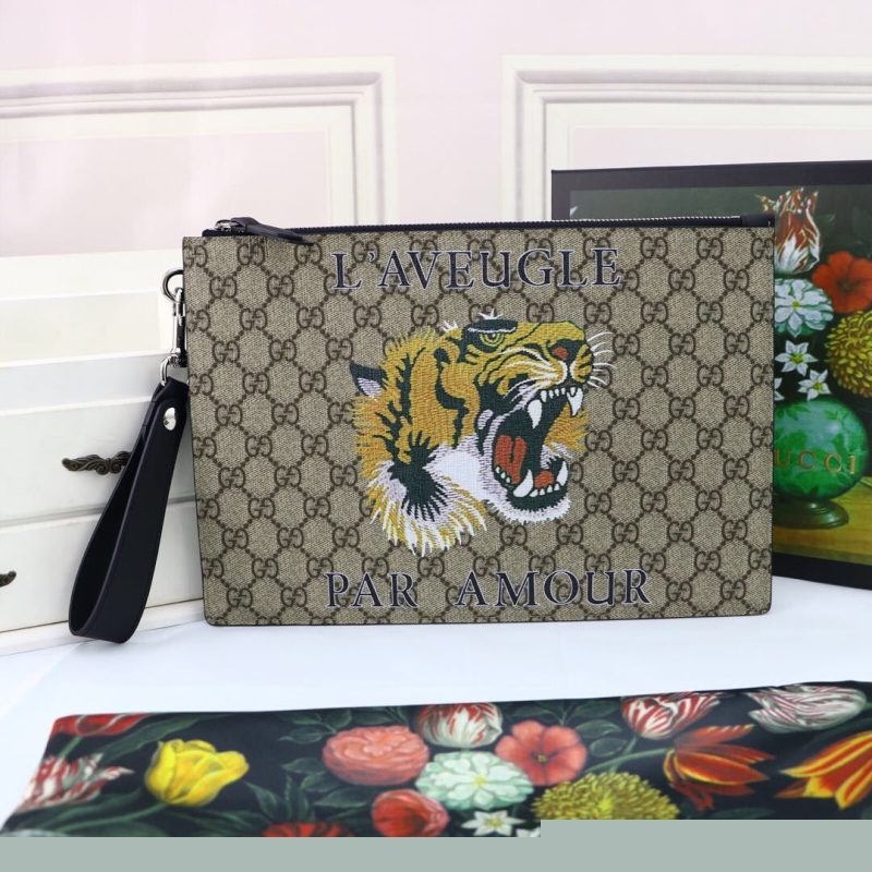 G*u*i clutch bags